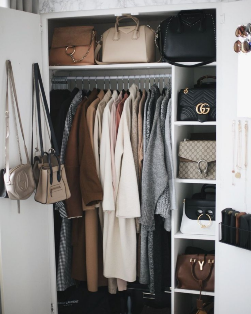 Neatly organised neutral wardrobe with coordinated summer clothing.