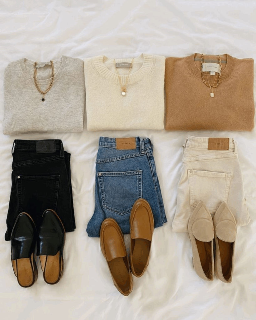 Casual neutral outfit with loose trousers and flat sandals.