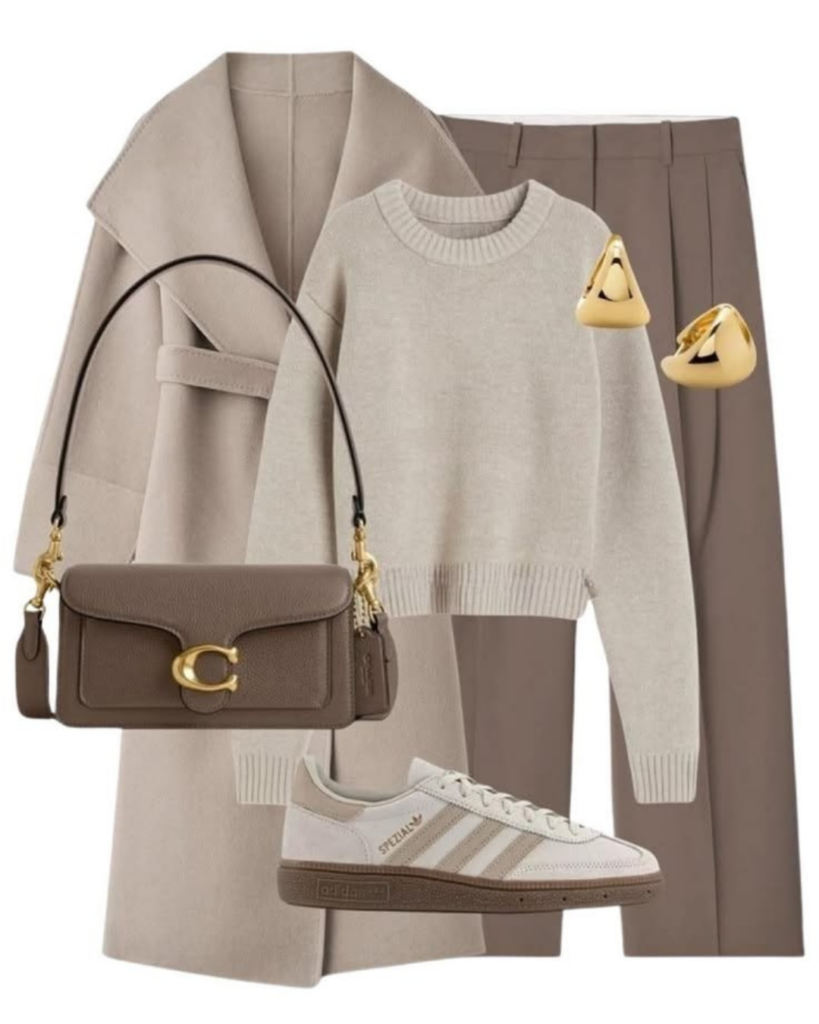 Neutral business casual outfit flat lay with tailored trousers, knit top, sneakers, handbag, and gold accessories.